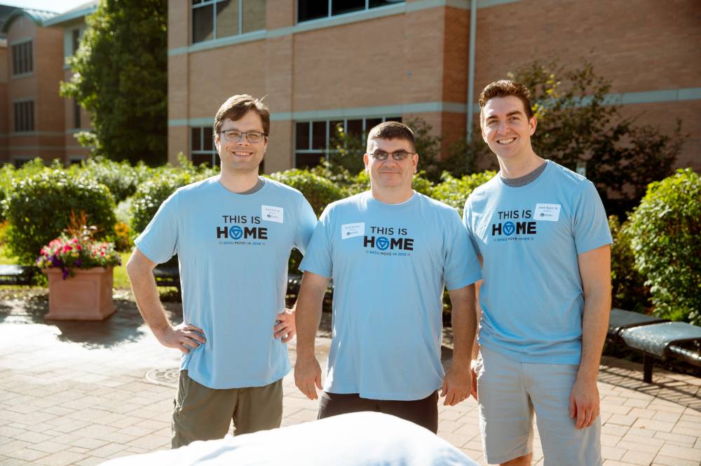 three volunteers outside honors college